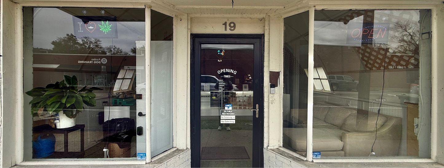Exterior of Hempire Innovations hemp dispensary storefront at 19 S 16th Street in Wilmington, NC offering THCa flower, Delta 8, and Delta 9 products.